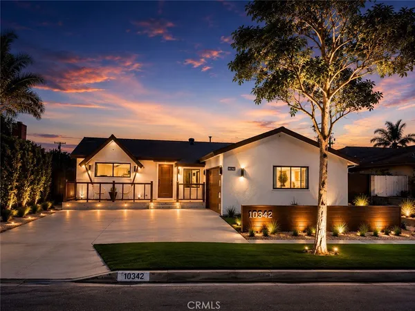 a house view with a sitting space and garden