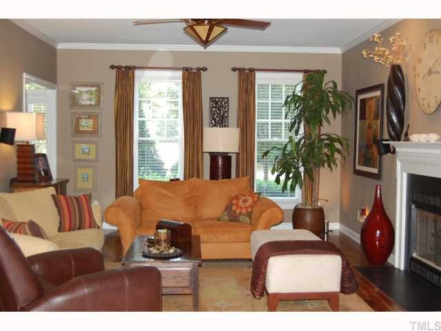 5824 Ventry Court Raleigh, NC 27613 - Photo 3 of 12 Spacious yet comfortable. Walnut hardwood floors and upgraded crown molding. Gas Logs perfect for those cozy nights! French doors entering into office from this family gathering place. Den/Family/Great Room