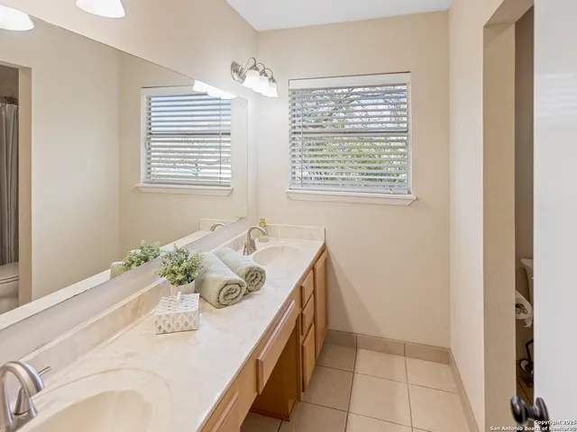 a bath room with a sink and a bath tub