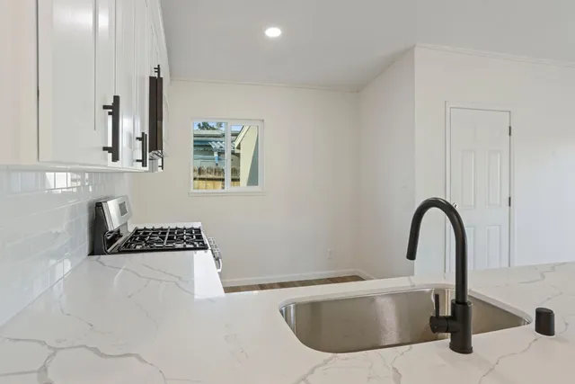 a close view of a sink and a bathtub in a bathroom