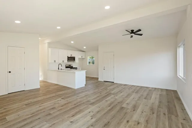 a view of kitchen with wooden floor and window