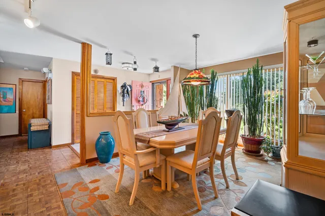 a dining room with furniture window wooden floor