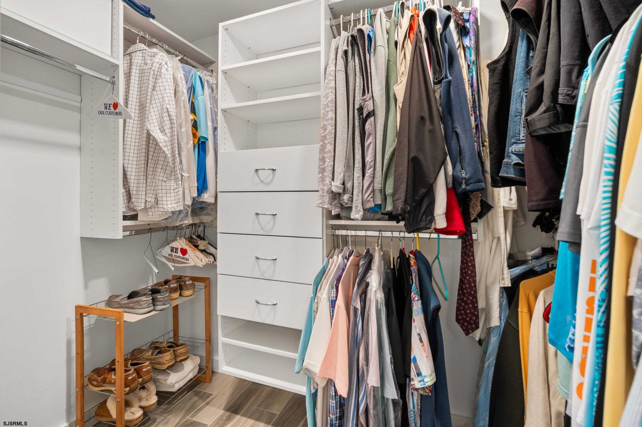202 North Shore Road Marmora, NJ 08223 - Photo 21 of 31 a view of walk in closet with clothes and shoes