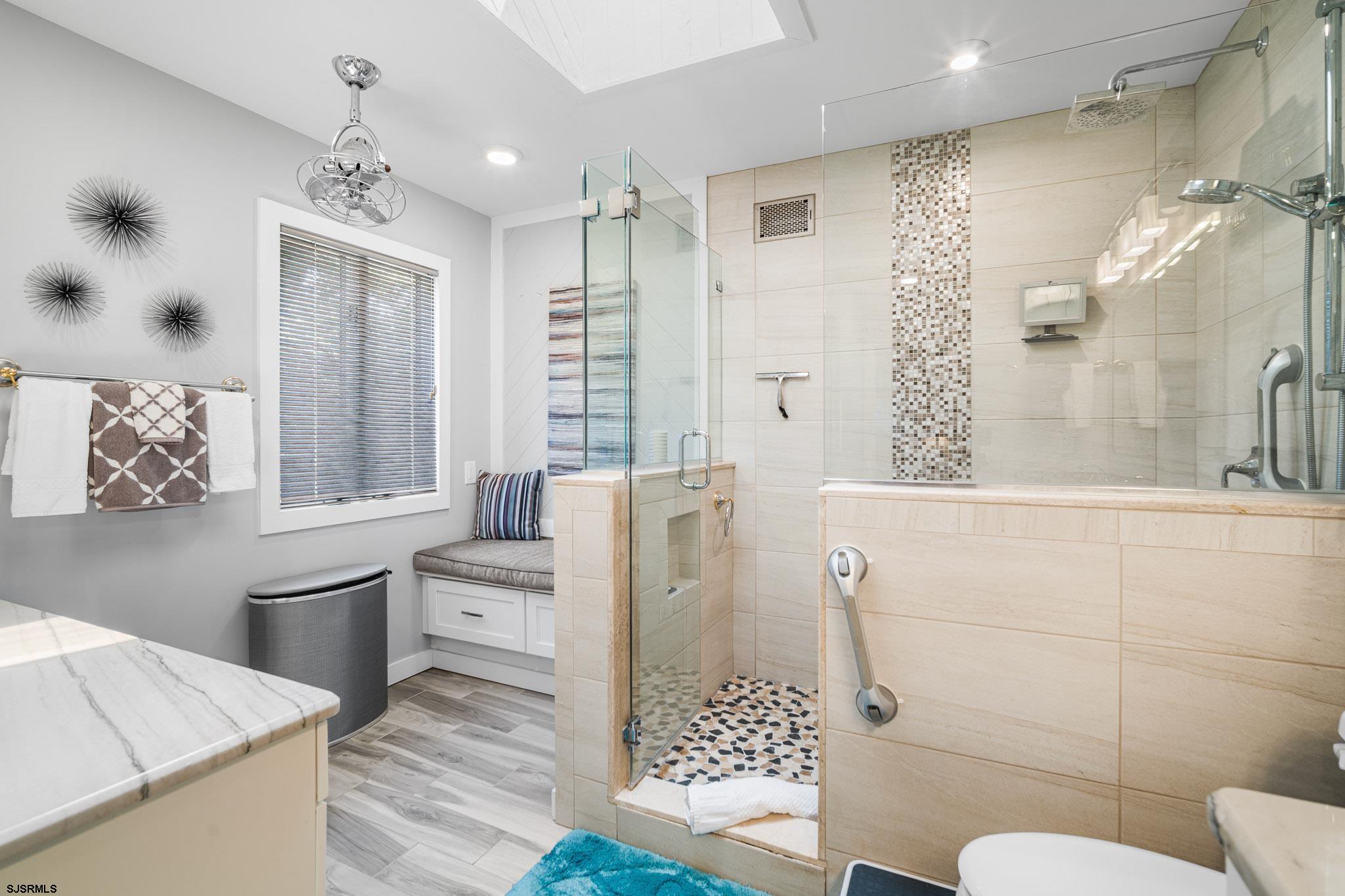 202 North Shore Road Marmora, NJ 08223 - Photo 23 of 31 a bathroom with a sink a toilet and shower