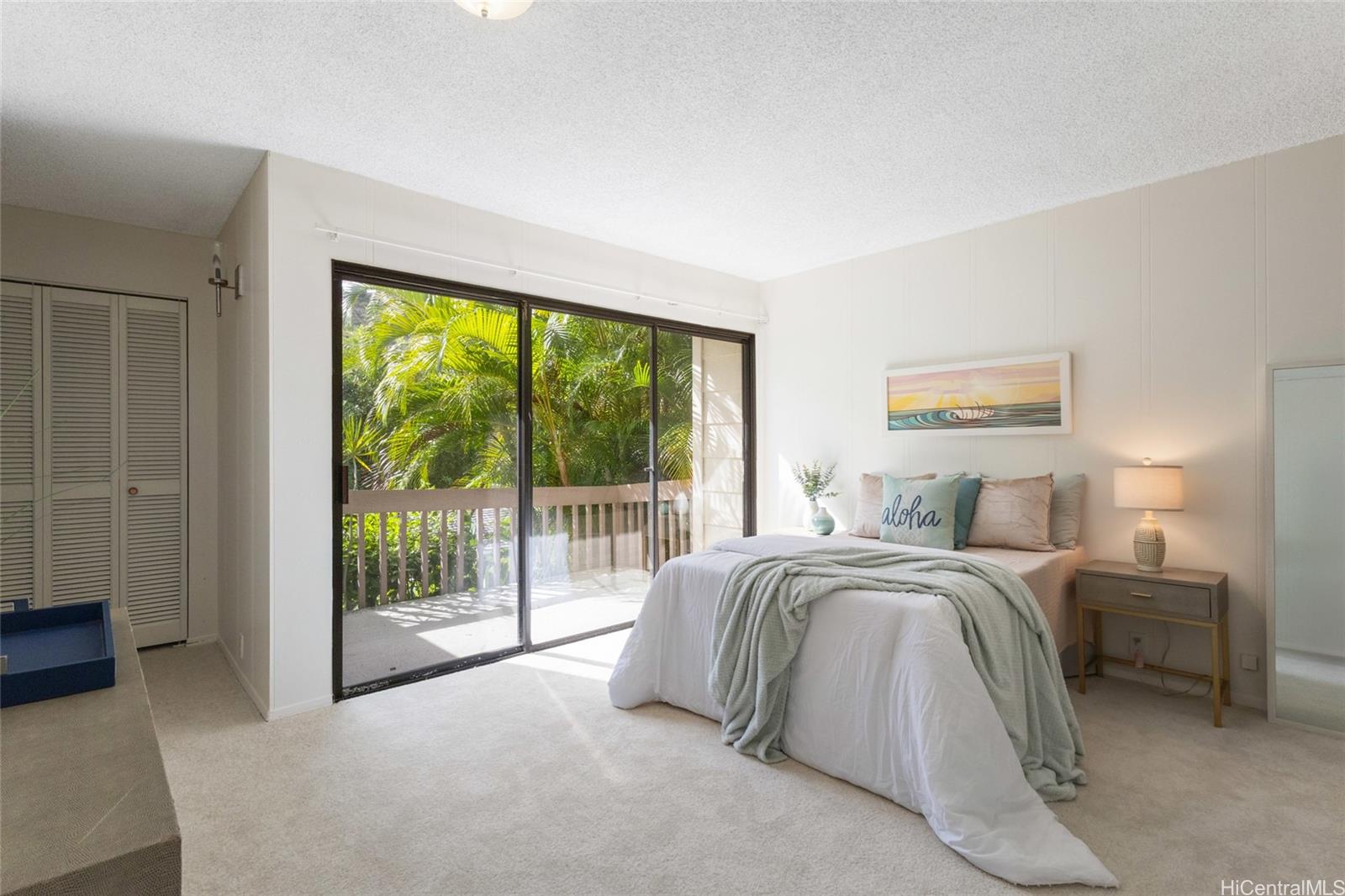 1630 Kalaniiki Street, Unit 31 Honolulu, HI 96821 - Photo 11 of 25 a spacious bedroom with a bed and a large window
