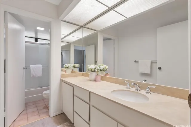 a bathroom with a double vanity sink and mirror