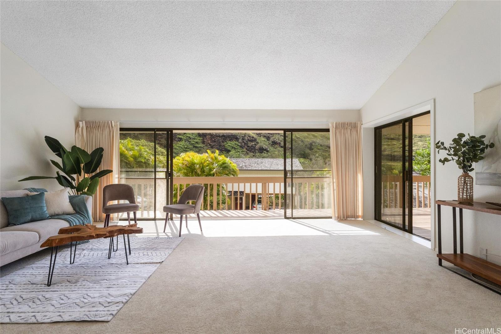 1630 Kalaniiki Street, Unit 31 Honolulu, HI 96821 - Photo 2 of 25 a living room with furniture and a large window with outer view