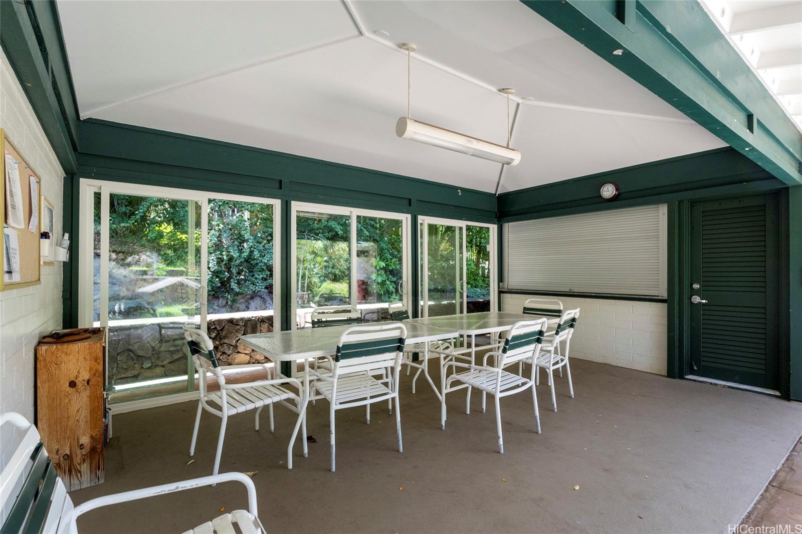 1630 Kalaniiki Street, Unit 31 Honolulu, HI 96821 - Photo 23 of 25 a dining room with furniture water view and a chandelier