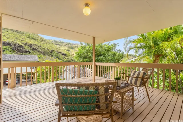a view of balcony with furniture