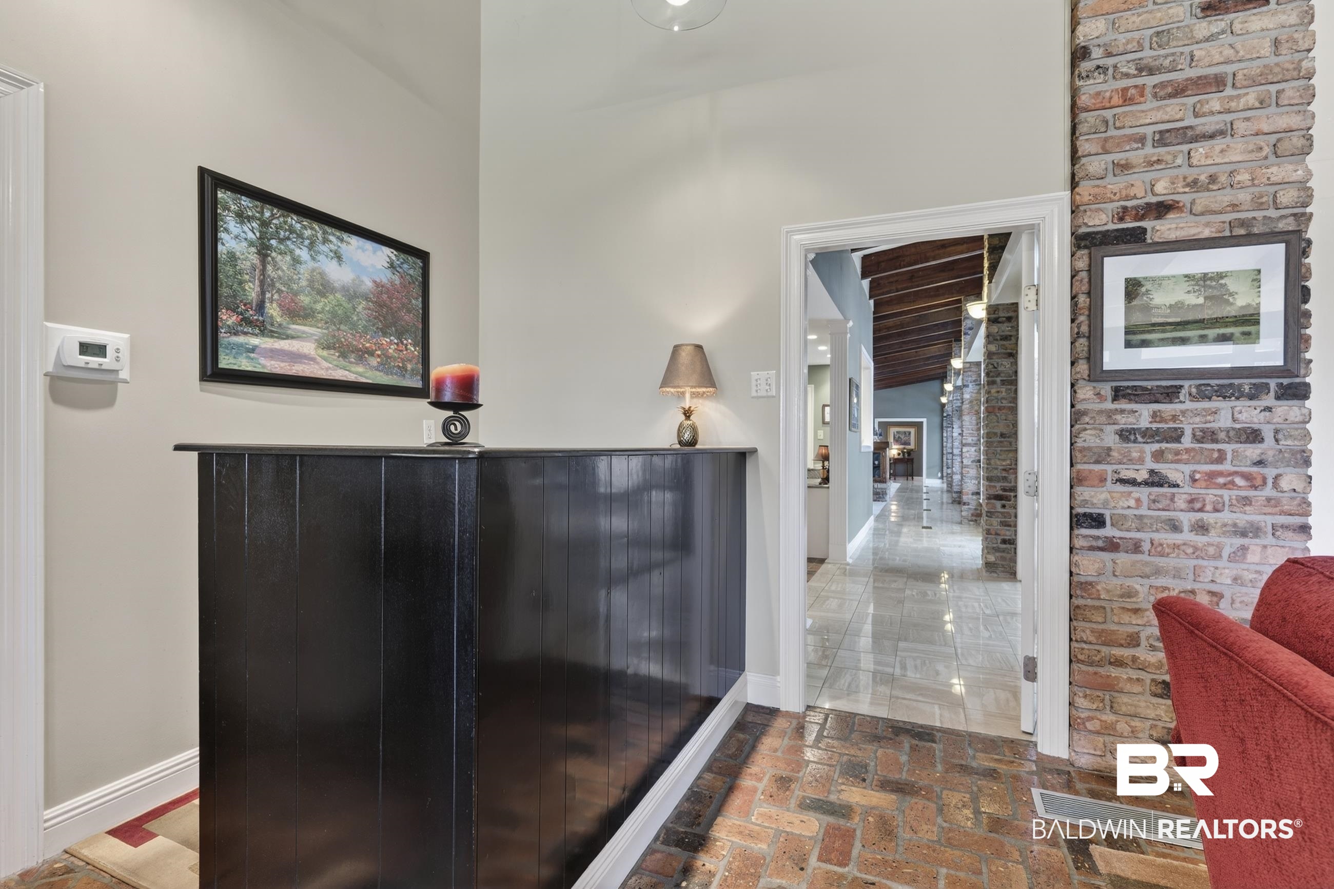 3175 Dawes Lake Road Mobile, AL 36619 - Photo 3 of 92 Corridor with brick floors and brick wall