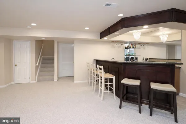 a kitchen with a table and chairs