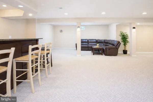 a large room with furniture and a living room
