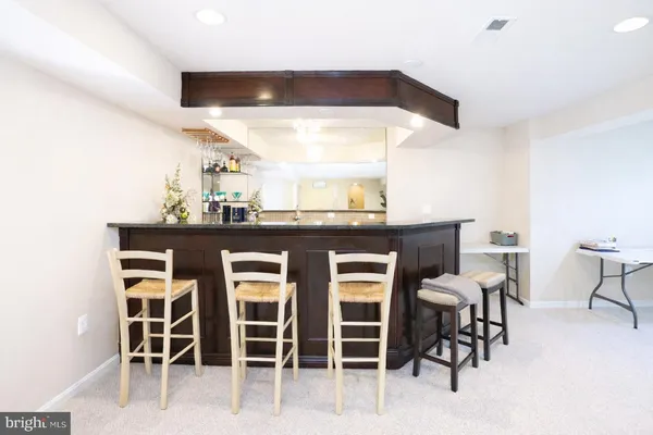 a kitchen with a table and chairs in it