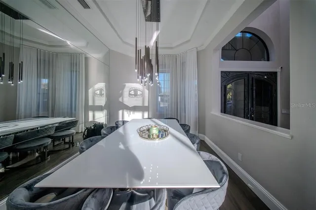 a dining room with furniture and window