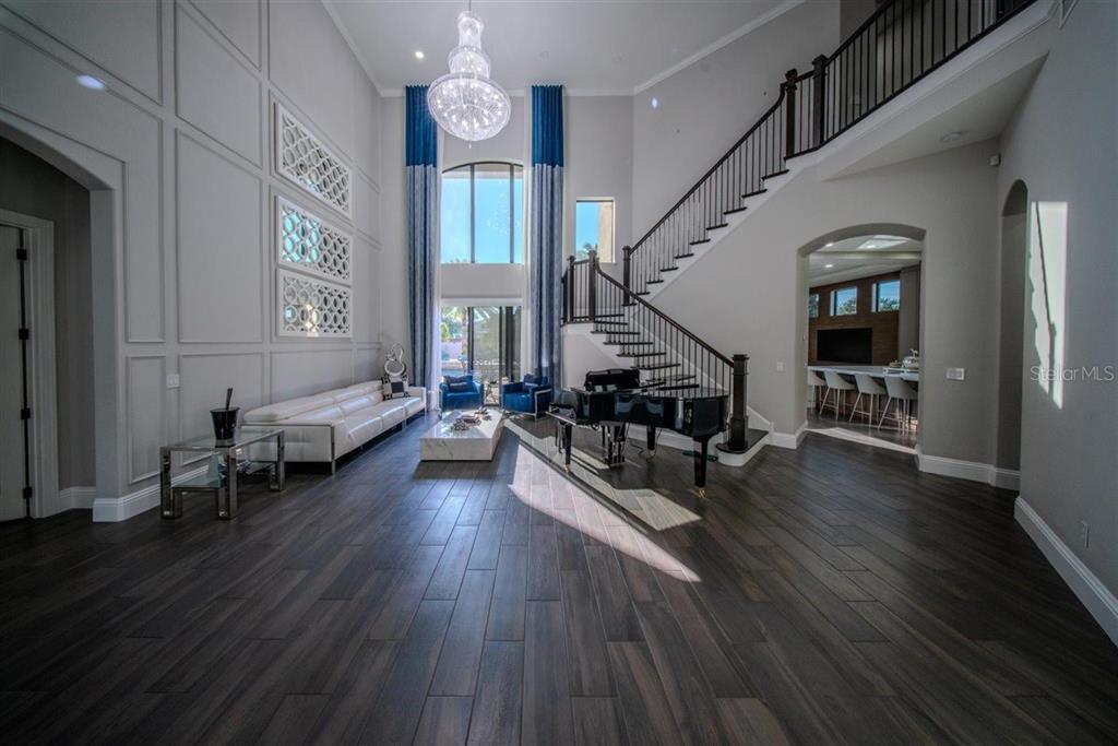 4303 Isabella Circle Windermere, FL 34786 - Photo 26 of 77 a living room with furniture and wooden floor