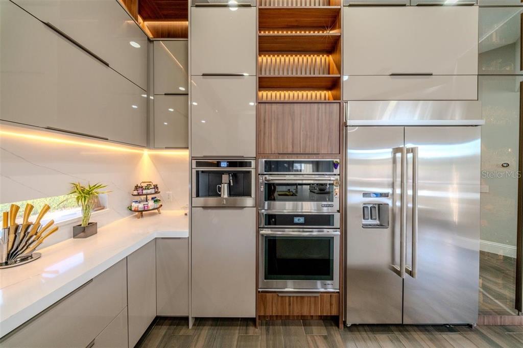 4303 Isabella Circle Windermere, FL 34786 - Photo 31 of 77 a kitchen with a refrigerator and a stove