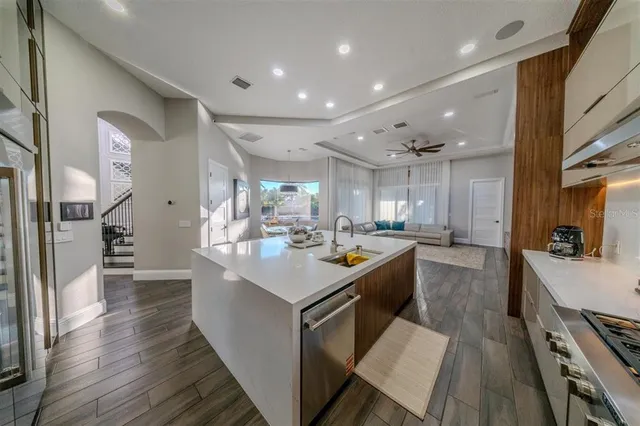 a view of a swimming pool with a garden and patio