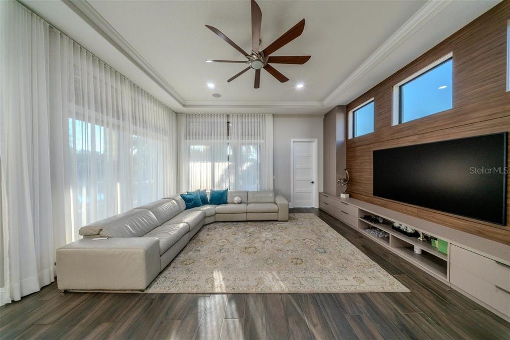 4303 Isabella Circle Windermere, FL 34786 - Photo 37 of 77 a living room with furniture and a flat screen tv