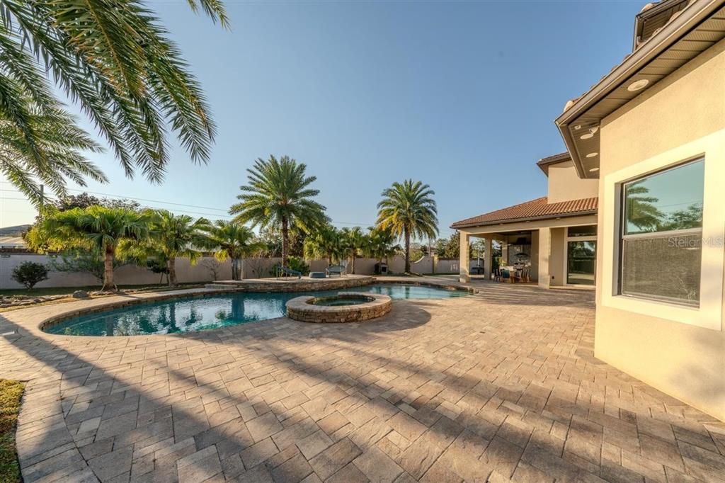 4303 Isabella Circle Windermere, FL 34786 - Photo 52 of 77 a view of a swimming pool with a patio
