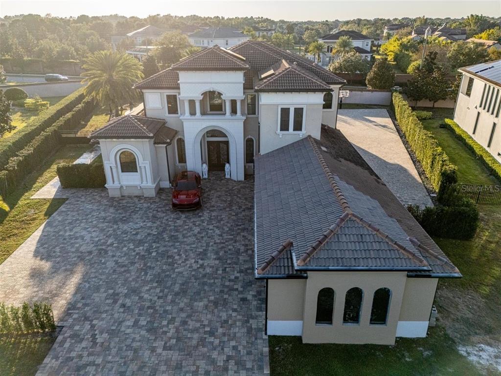 4303 Isabella Circle Windermere, FL 34786 - Photo 6 of 77 a front view of a house with a yard
