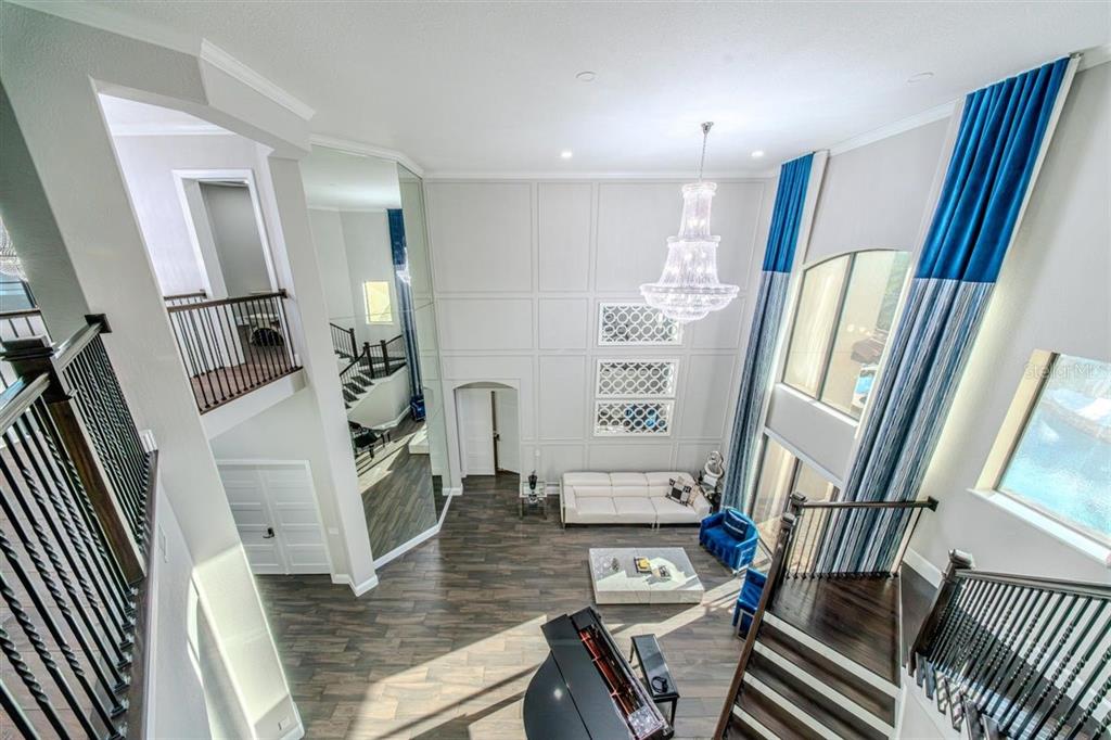 4303 Isabella Circle Windermere, FL 34786 - Photo 63 of 77 a living room with furniture and a wooden floor