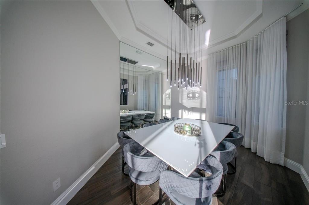 4303 Isabella Circle Windermere, FL 34786 - Photo 75 of 77 a view of a dining room with furniture