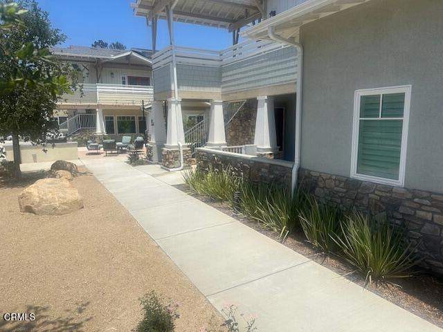 307 North F Street, Unit 102 Oxnard, CA 93030 - Photo 2 of 12 a view of a dinning table and chairs in patio of the house