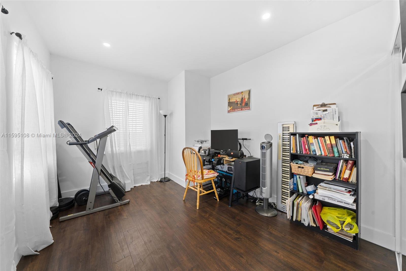 923 Southwest 13th Court Miami, FL 33135 - Photo 24 of 58 a view of a workspace with furniture and wooden floor