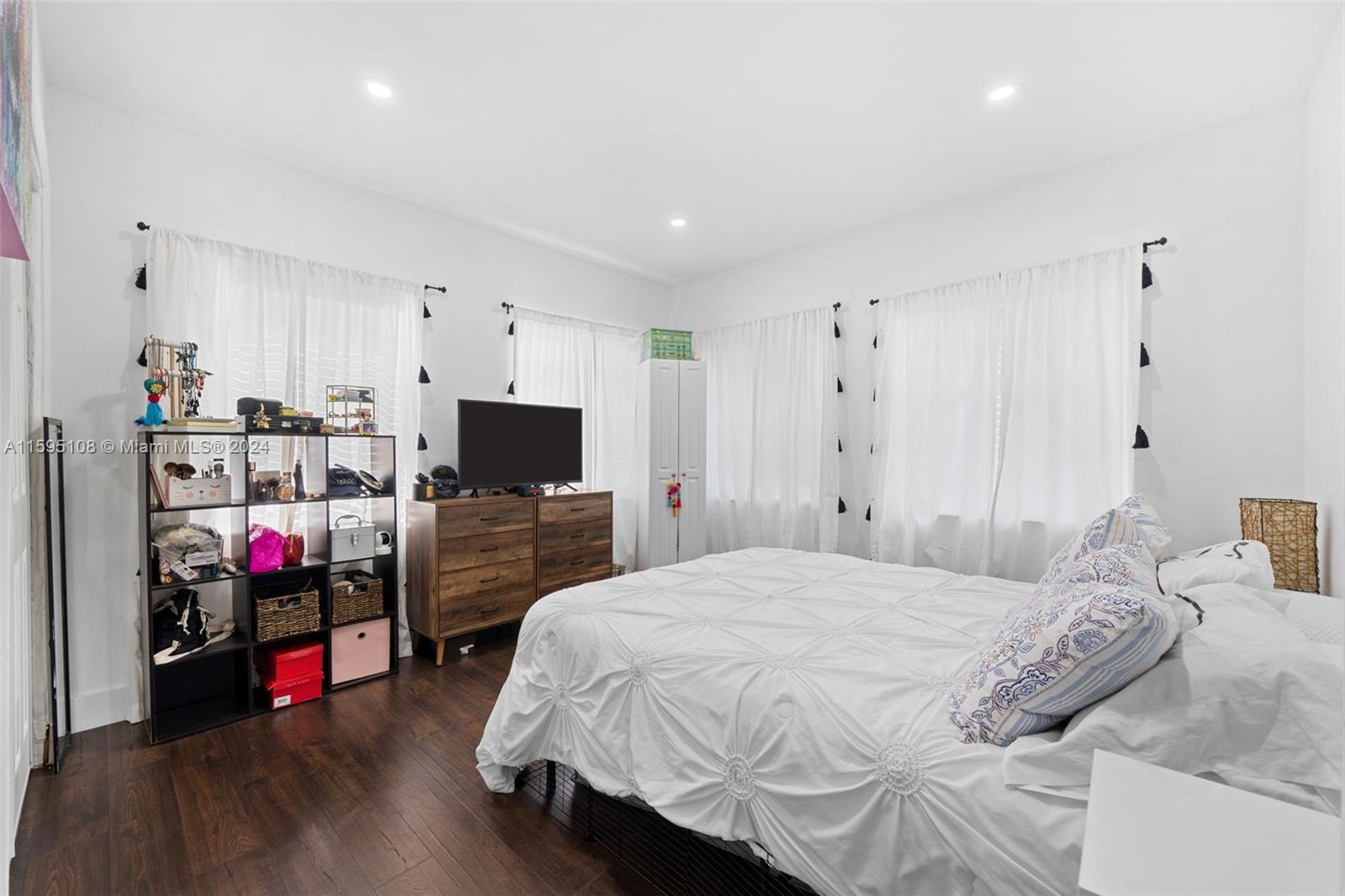 923 Southwest 13th Court Miami, FL 33135 - Photo 25 of 58 a bedroom with a bed and a tv