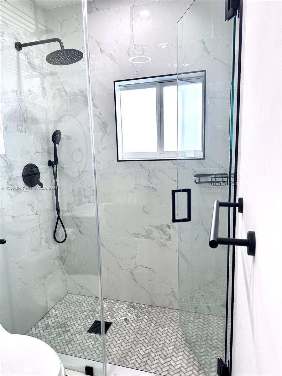 923 Southwest 13th Court Miami, FL 33135 - Photo 29 of 58 a bathroom with a sink toilet and shower