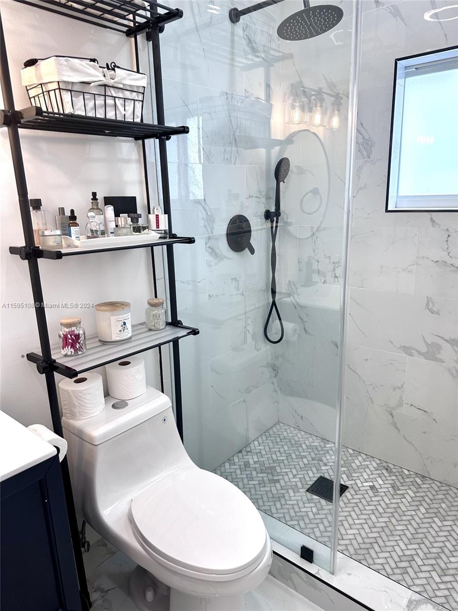 923 Southwest 13th Court Miami, FL 33135 - Photo 30 of 58 a bathroom with a toilet and a shower
