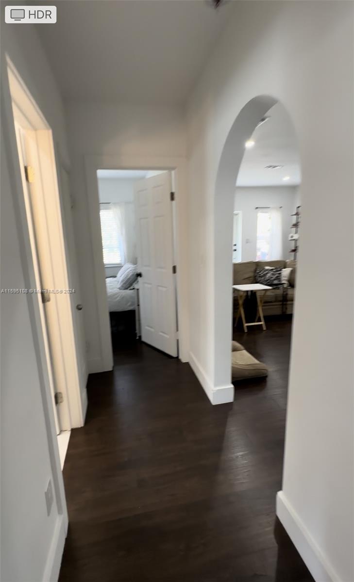 923 Southwest 13th Court Miami, FL 33135 - Photo 31 of 58 a view of a hallway view with wooden floor and seating space
