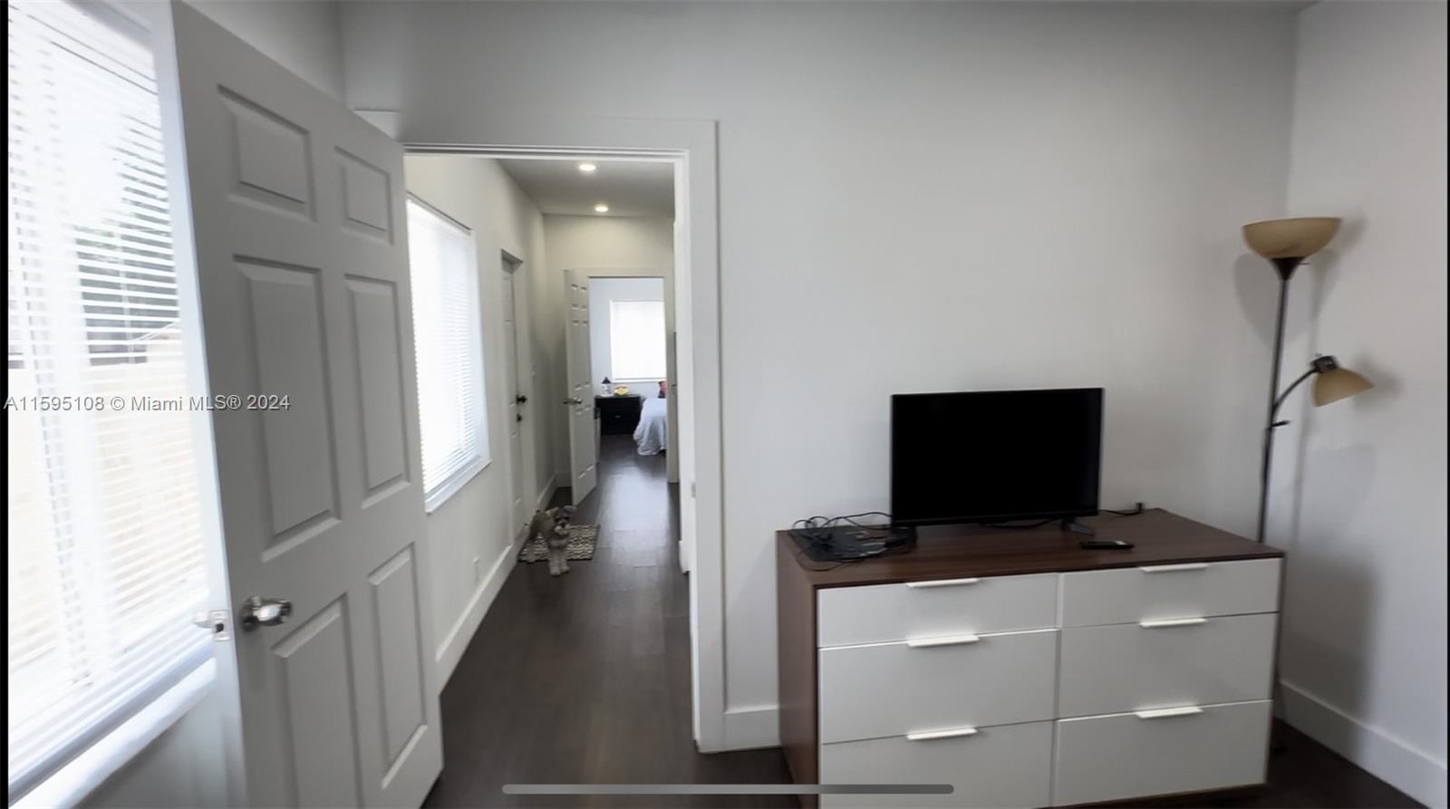 923 Southwest 13th Court Miami, FL 33135 - Photo 34 of 58 a living room with a flat screen tv and a window