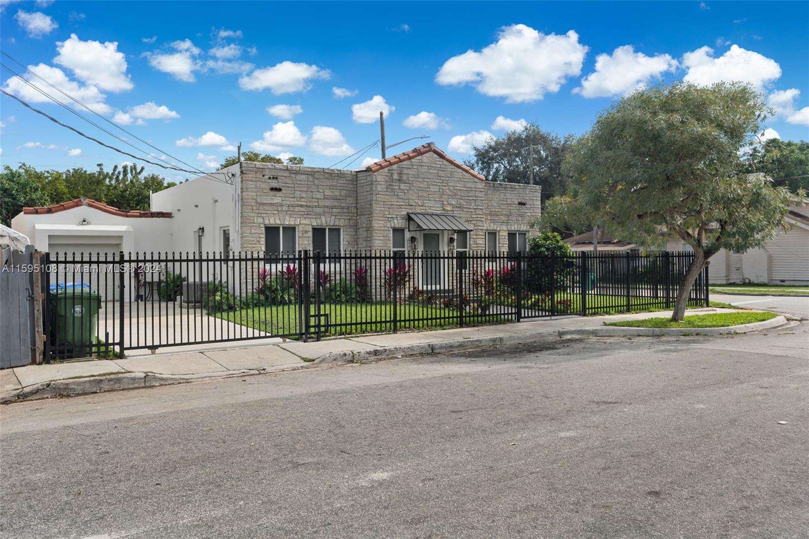 923 Southwest 13th Court Miami, FL 33135 - Photo 4 of 58 a view of a house with a backyard and a yard