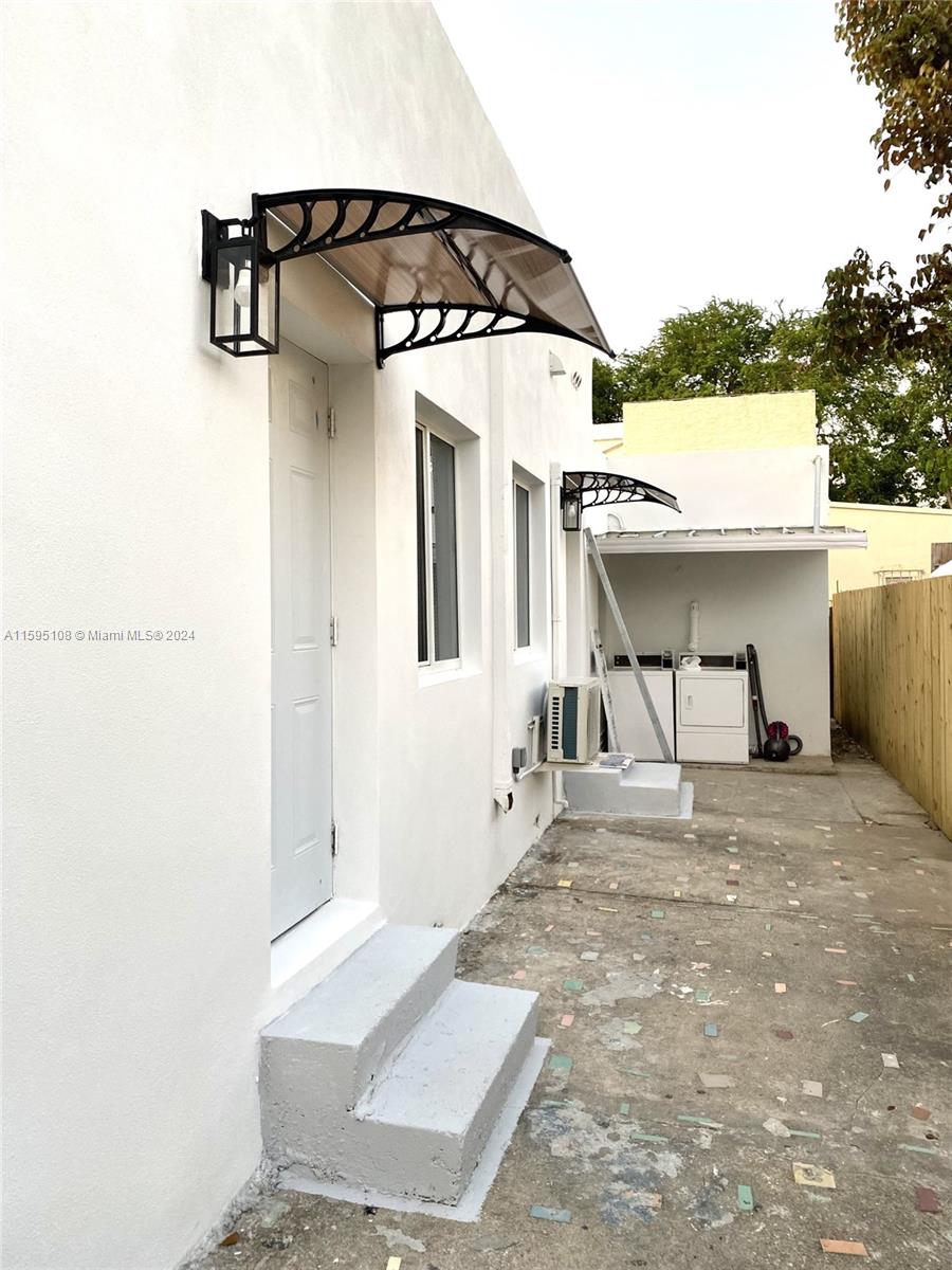 923 Southwest 13th Court Miami, FL 33135 - Photo 41 of 58 a view of a house with porch