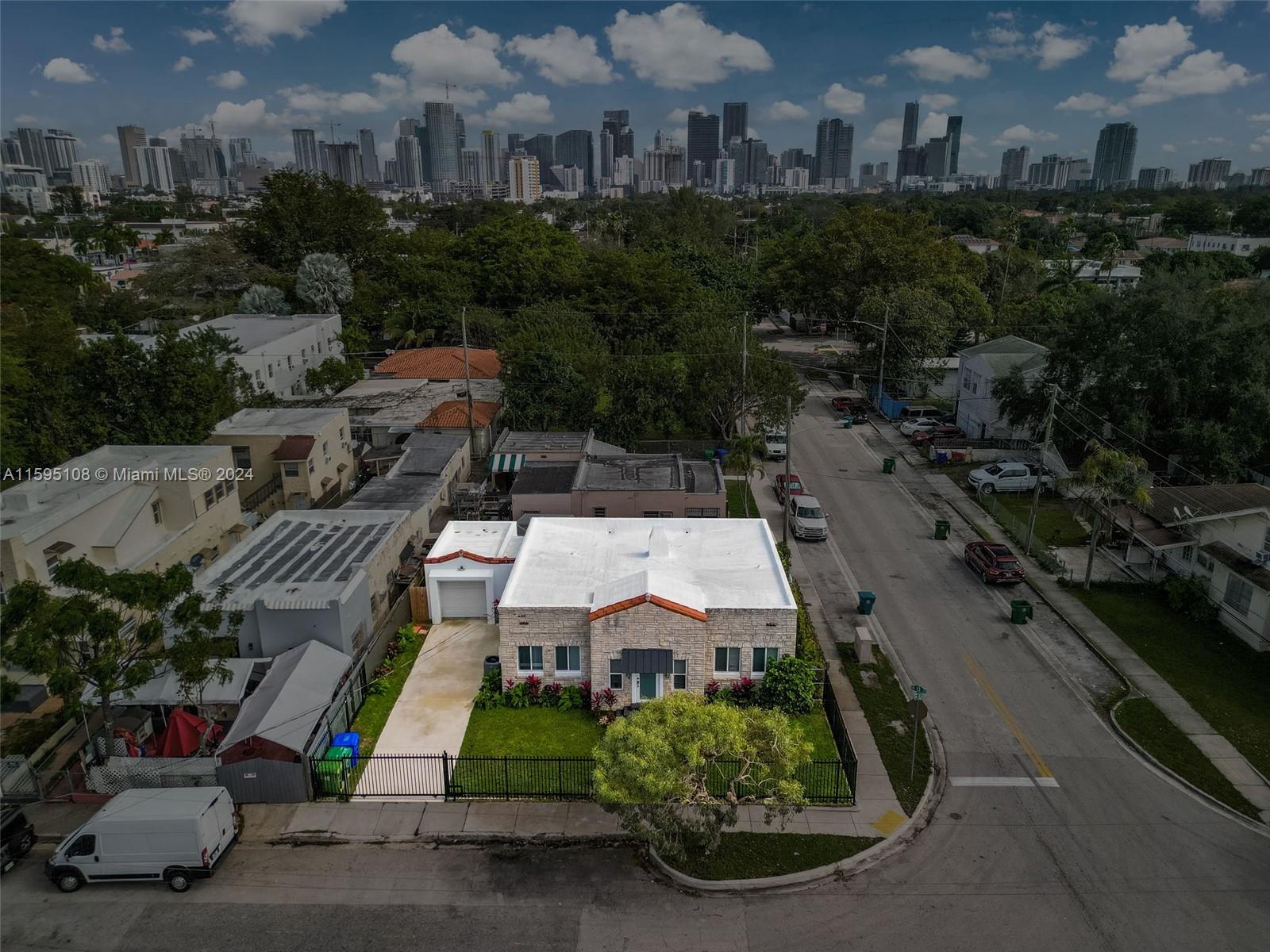 923 Southwest 13th Court Miami, FL 33135 - Photo 57 of 58 an aerial view of multiple houses with yard