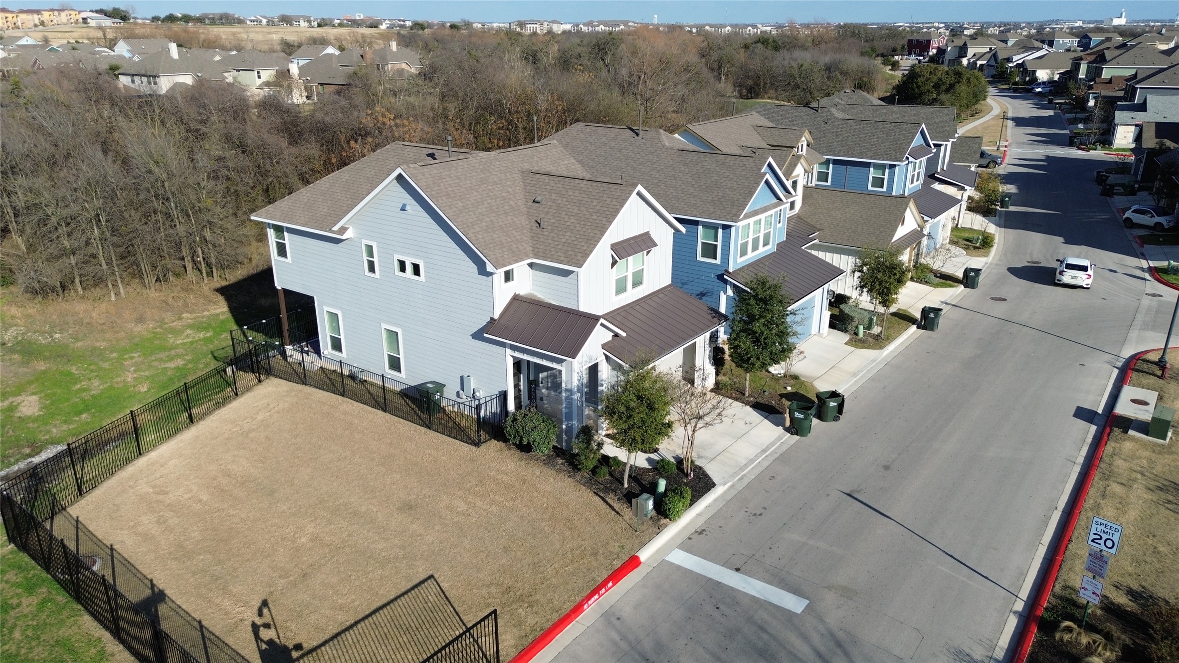 1007 Harwell Loop Kyle, TX 78640 - Photo 2 of 40 an aerial view of a house with a yard and lake view