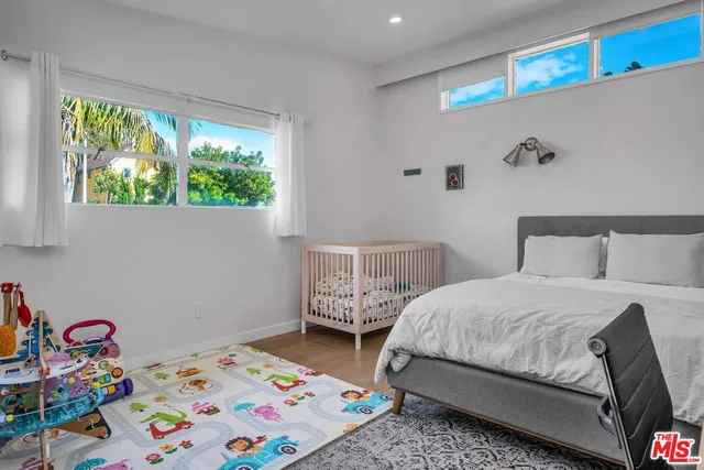 a bedroom with a bed and a table in it