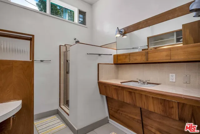 a kitchen with stainless steel appliances a refrigerator and cabinets