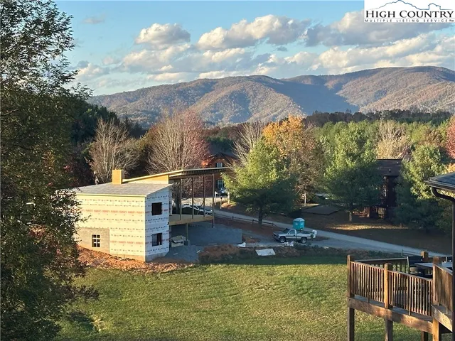 a view of a swimming pool with a yard