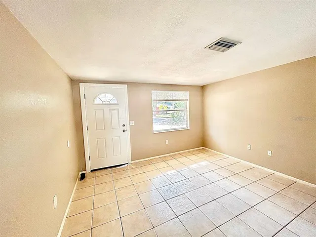 a view of an empty room and window