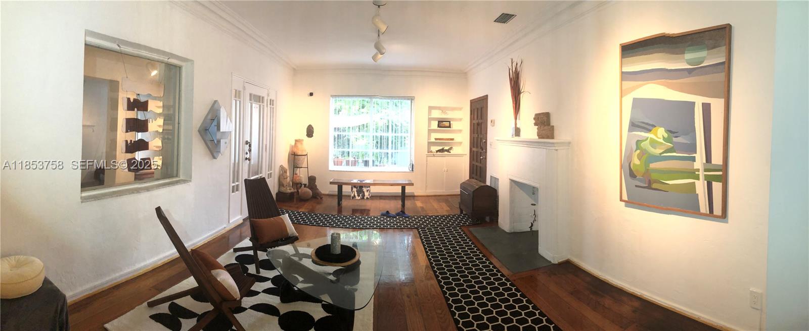 a living room with furniture and a rug