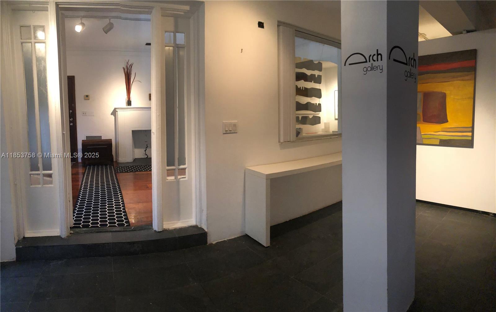 1619 Southwest 13th Street Miami, FL 33145 - Photo 12 of 46 a view of a hallway with wooden floor and a cabinet