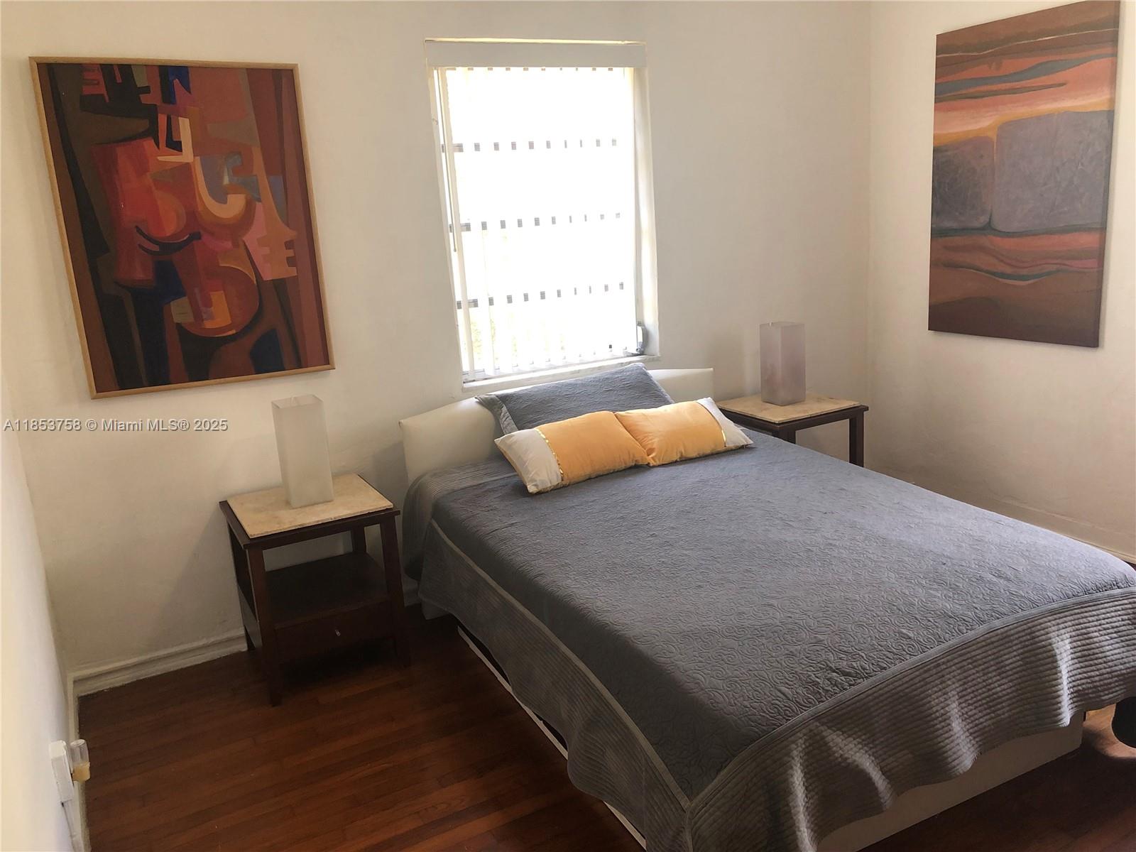 1619 Southwest 13th Street Miami, FL 33145 - Photo 23 of 46 a bedroom with a bed and window