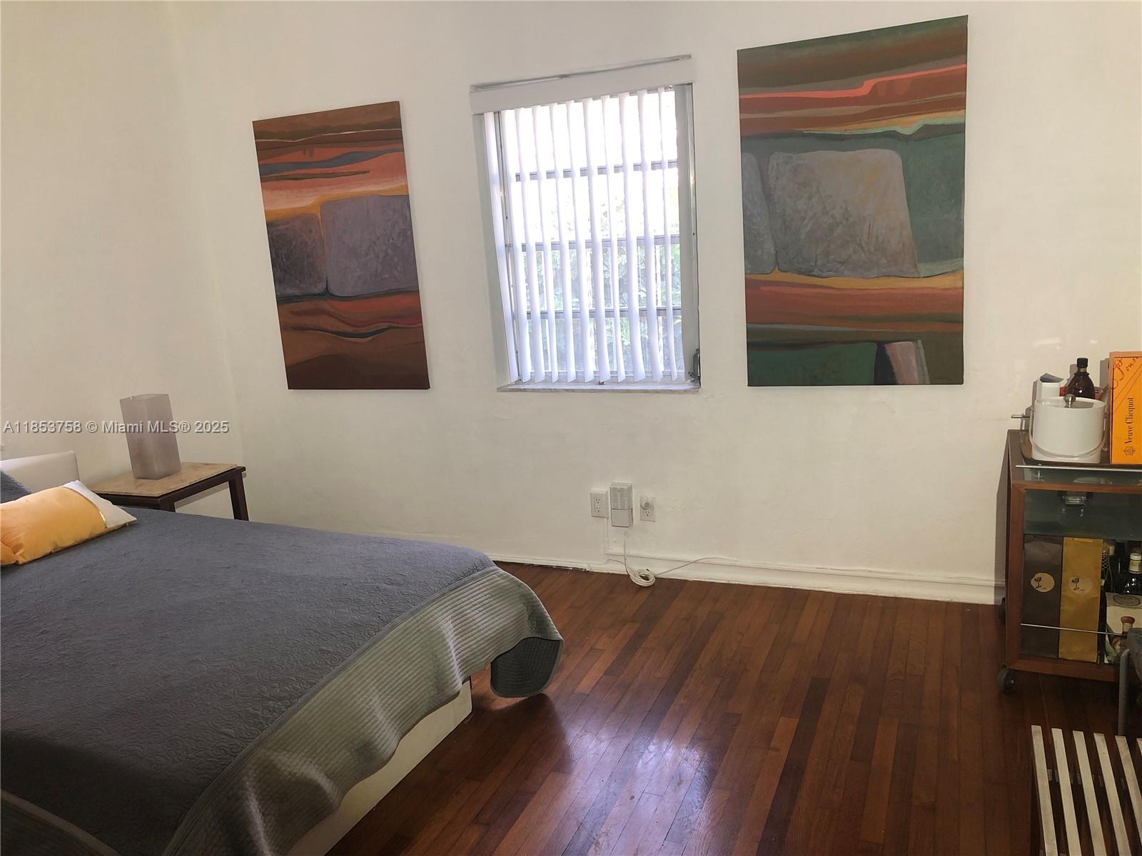 1619 Southwest 13th Street Miami, FL 33145 - Photo 24 of 46 a bedroom with a bed and a window