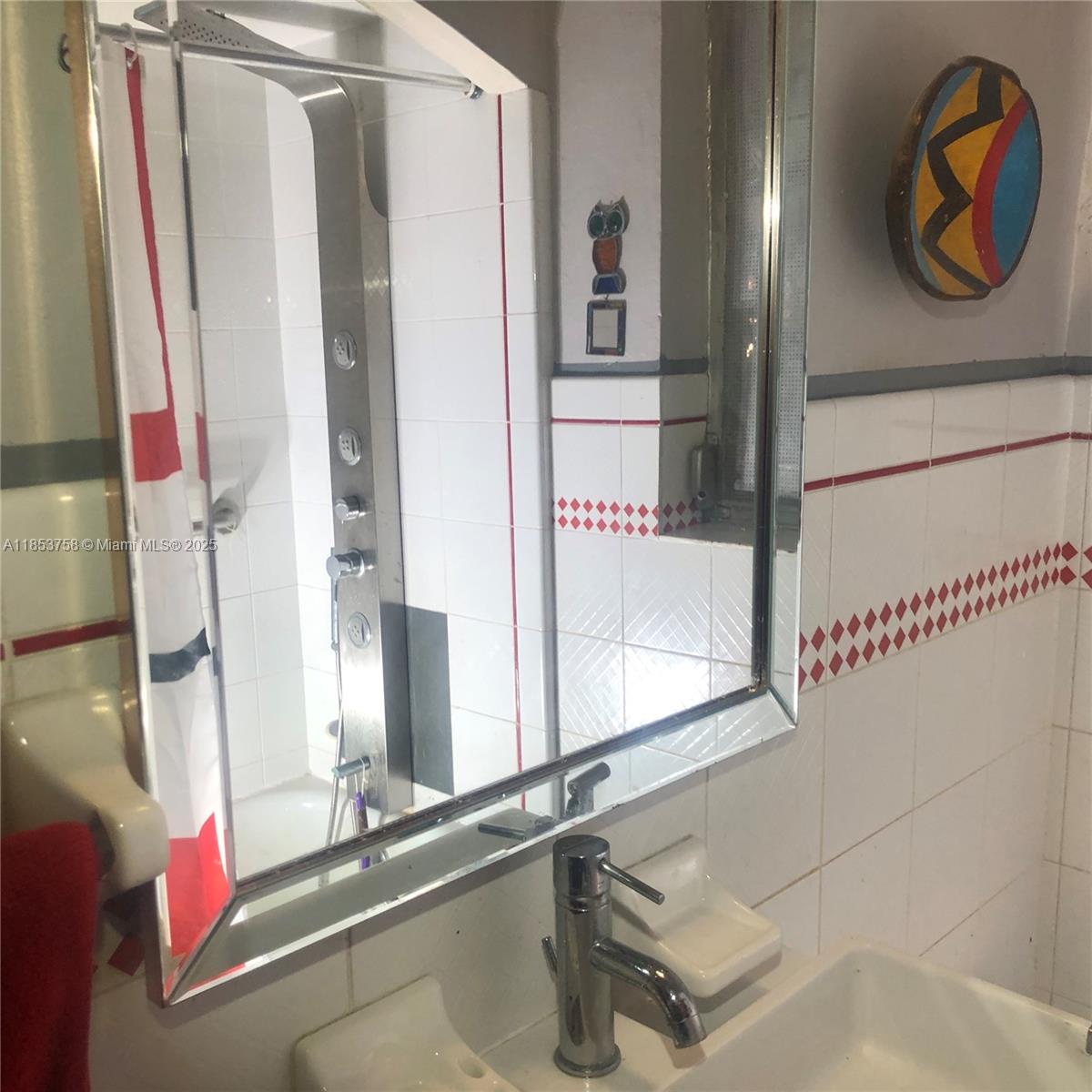 1619 Southwest 13th Street Miami, FL 33145 - Photo 27 of 46 a bathroom with a sink and a mirror