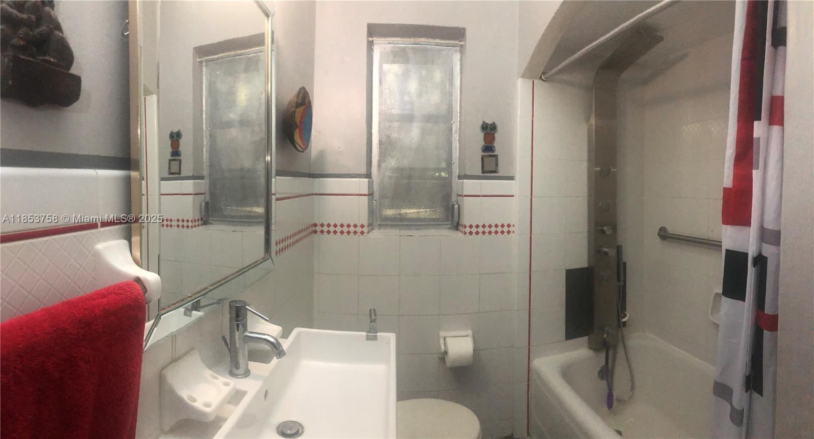 1619 Southwest 13th Street Miami, FL 33145 - Photo 28 of 46 a bathroom with a sink toilet and shower