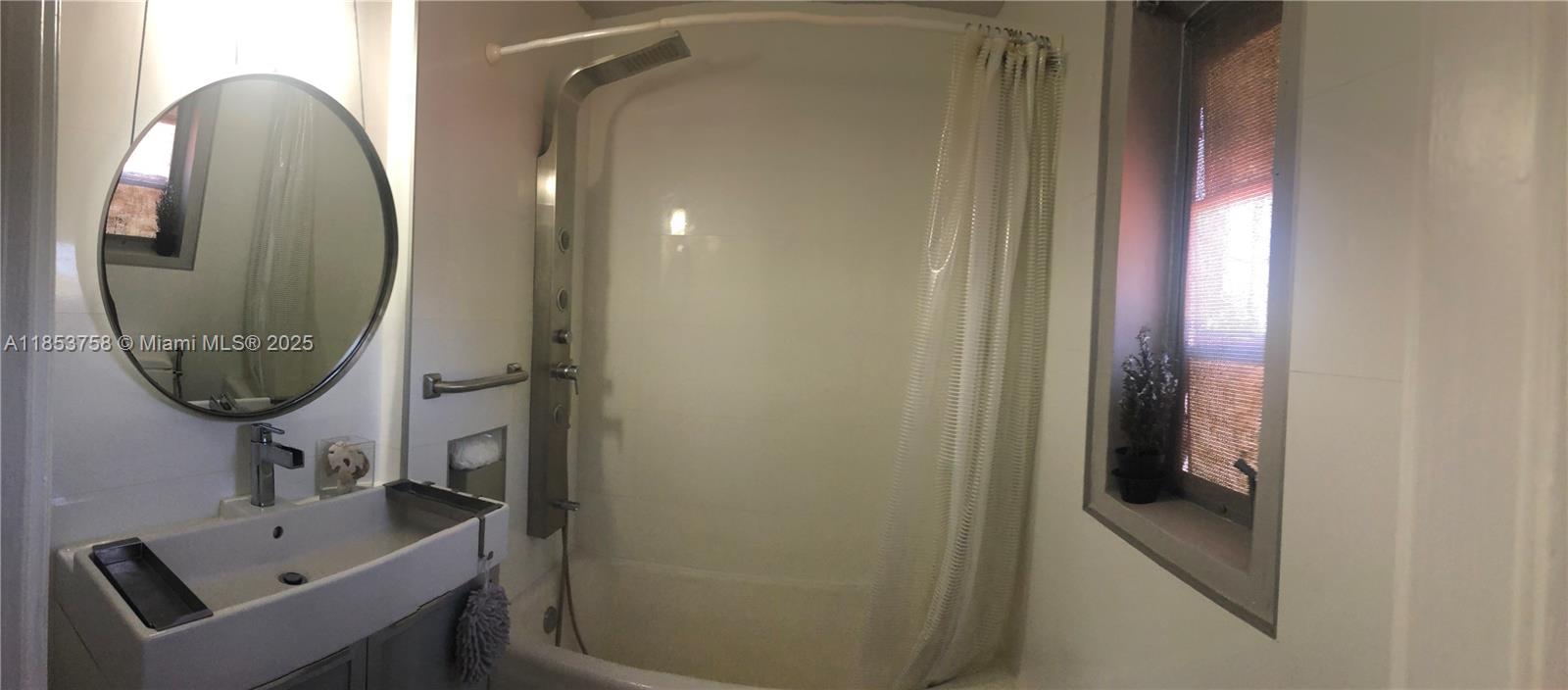 1619 Southwest 13th Street Miami, FL 33145 - Photo 36 of 46 a bathroom with a sink and a mirror