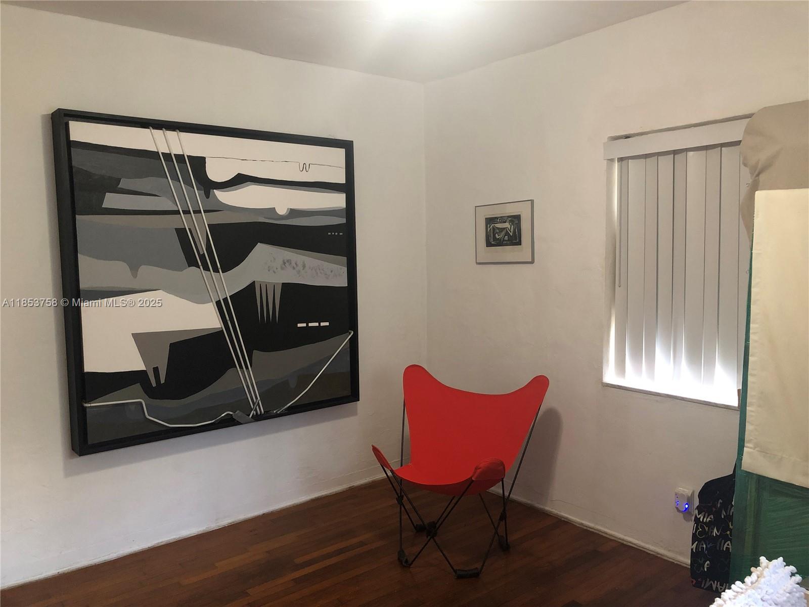 1619 Southwest 13th Street Miami, FL 33145 - Photo 37 of 46 a bedroom with a bed and a window