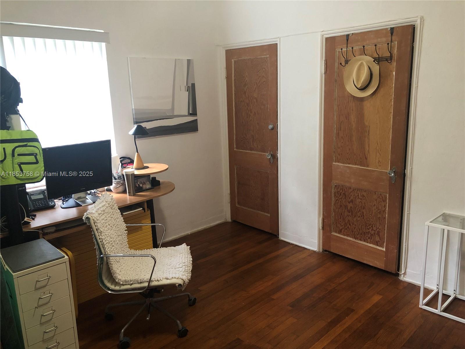 1619 Southwest 13th Street Miami, FL 33145 - Photo 38 of 46 a workspace with furniture and wooden floor